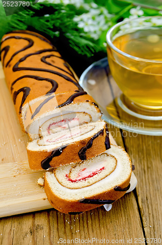 Image of Roulade with a cup of tea on board