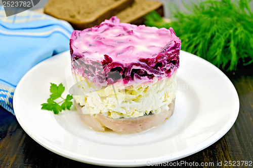 Image of Herring with vegetables in white plate