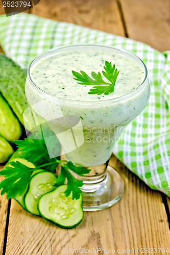 Image of Yoghurt with cucumber and parsley on the board