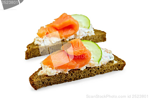 Image of Sandwiches on bread with salmon and cucumber