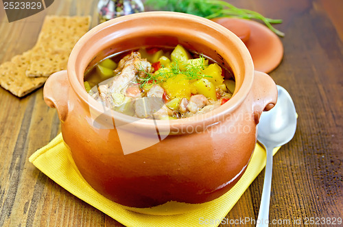 Image of Roast in a clay pot on a yellow napkin