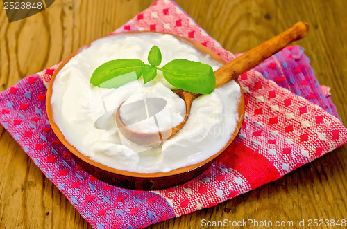 Image of Yogurt in a clay bowl with basil