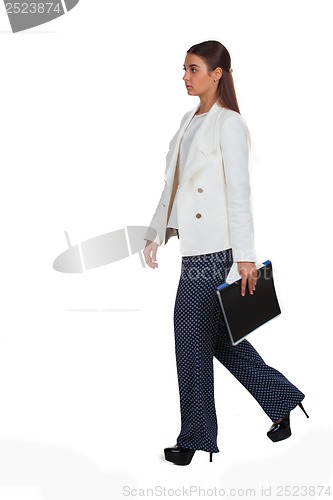 Image of Attractive cheerful businesswoman with folder