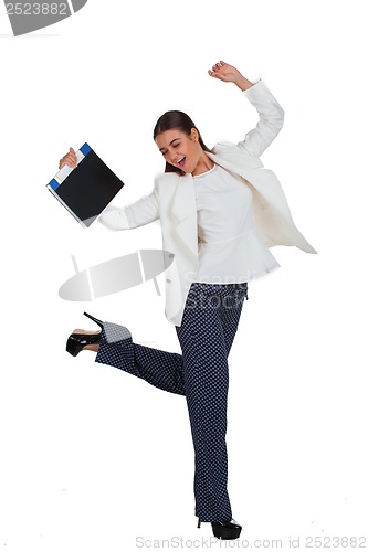 Image of Attractive cheerful businesswoman with folder