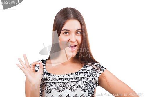 Image of Attractive young woman showing ok sign