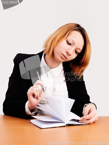 Image of Young red-haired businesswoman