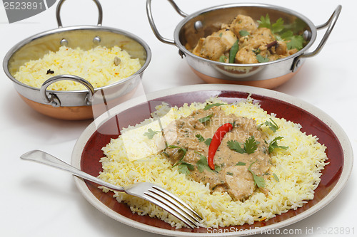 Image of Pasanda chicken meal with serving bowls
