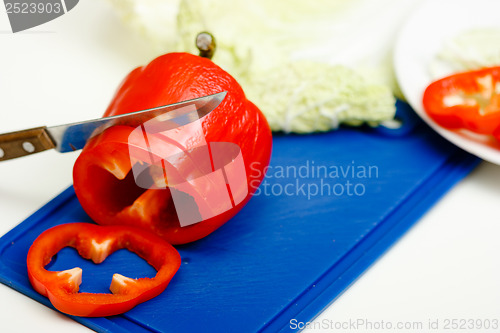 Image of Red pepper and a knife