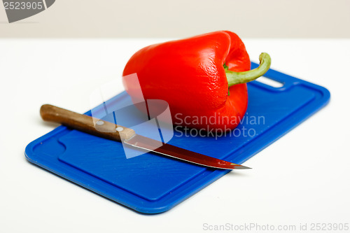 Image of Red pepper and a knife