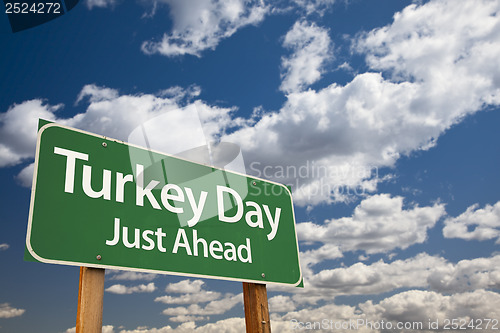 Image of Turkey Day Green Road Sign and Clouds