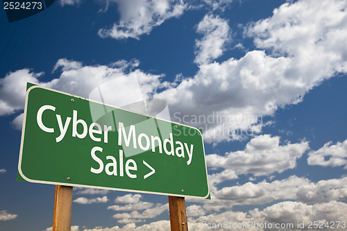 Image of Cyber Monday Sale Green Road Sign and Clouds