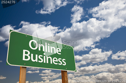 Image of Online Business Green Road Sign and Clouds