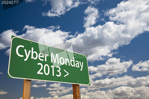 Image of Cyber Monday 2013 Green Road Sign and Clouds