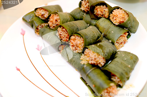 Image of Sticky rice steamed in bamboo leaves