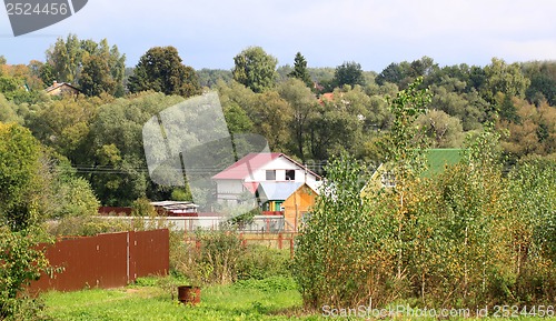 Image of The house in the village in the trees