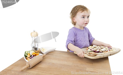 Image of child with home made pizza