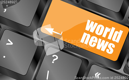 Image of words world news on computer keyboard key