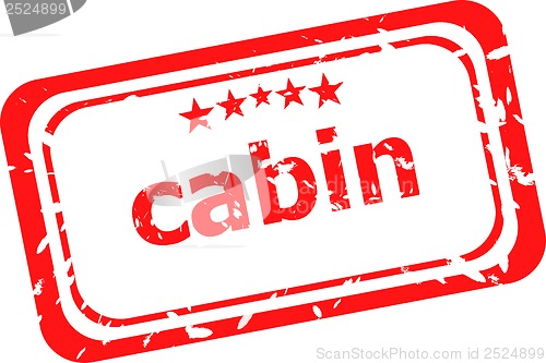 Image of cabin on red rubber stamp over a white background