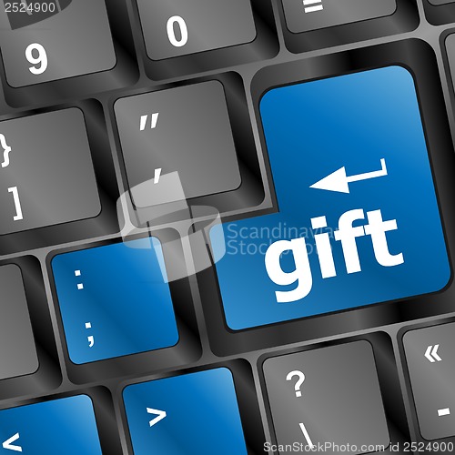 Image of Computer keyboard with gift key - business background