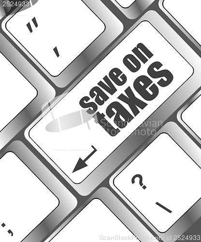 Image of save on taxes word on laptop keyboard key, business concept