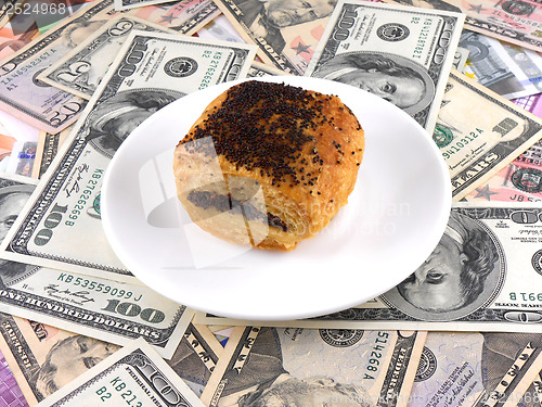 Image of sweet cake on money background