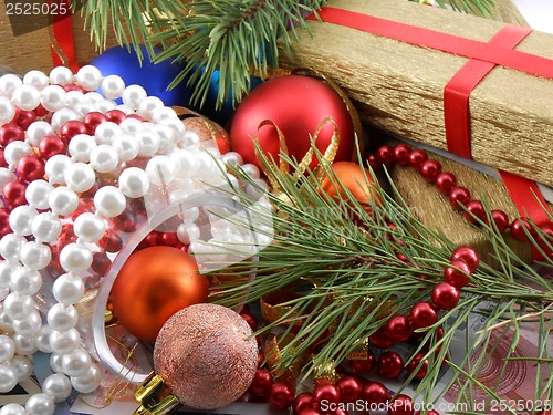 Image of Christmas gift box with new year balls, white diamonds and tree branch