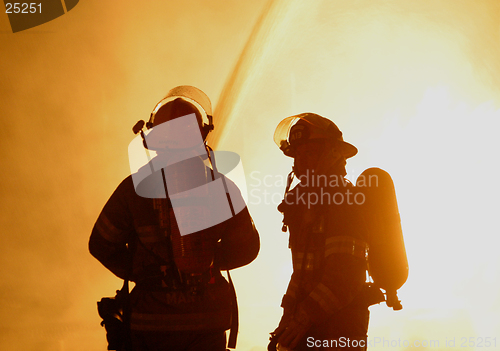 Image of two firefighters in silhouette