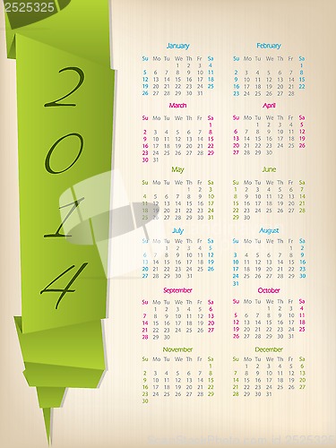 Image of 2014 calendar with green origami arrow