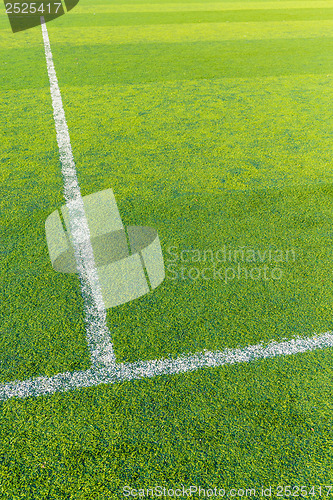 Image of White line on the green turf for football court