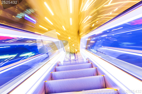 Image of Movement of diminishing hallway escalator