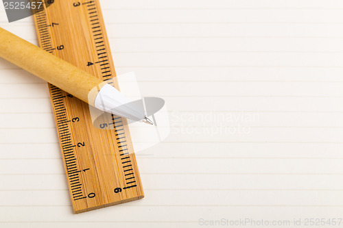 Image of Pen and ruler on the single line paper