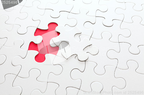 Image of Incomplete puzzle with missing piece