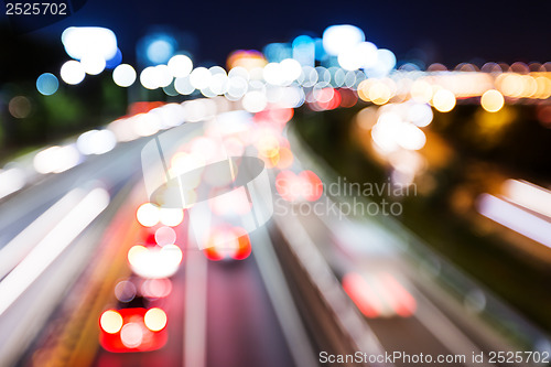 Image of Blurred unfocused highway view at night