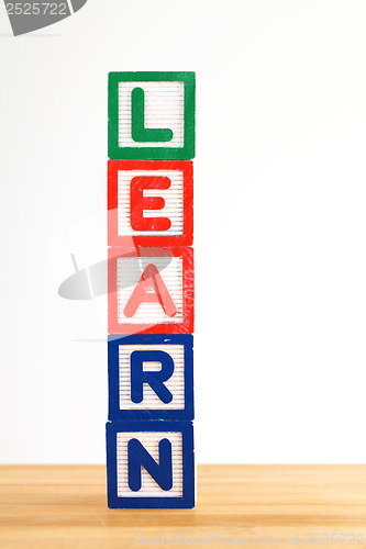 Image of Alphabet building blocks that spelling the word learn