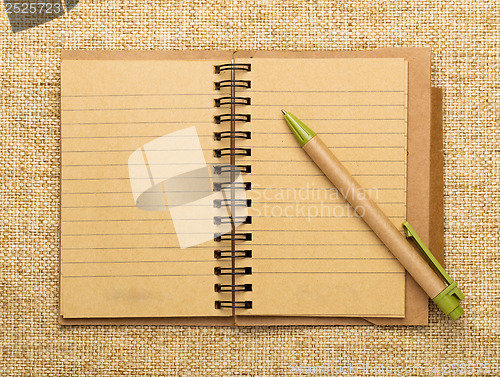 Image of Spiral notebook and pen