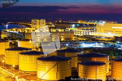 Image of Oil tanks plant during sunset