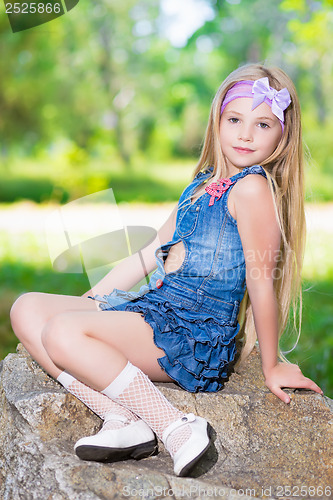Image of Little girl in jeans dress