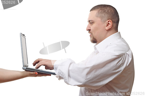 Image of Man typing on notebook