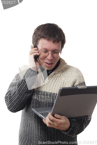 Image of Man with laptop and phone