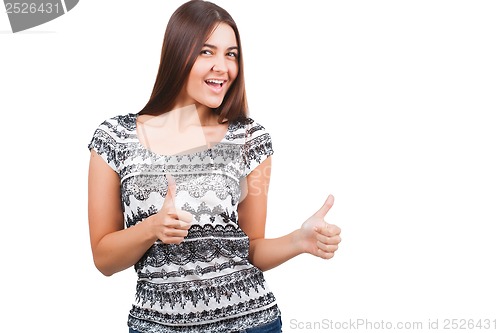 Image of Attractive young woman shows thumb up sign