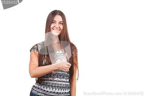 Image of Attractive young woman shows thumb up sign