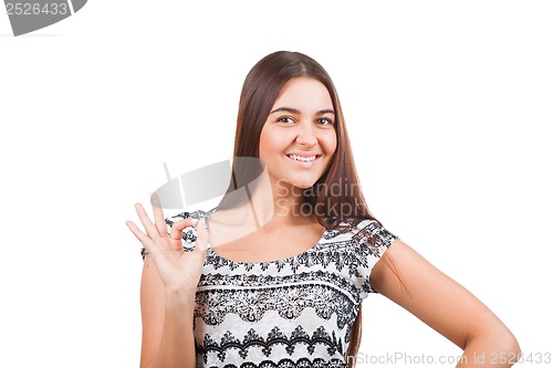 Image of Attractive young woman showing ok sign