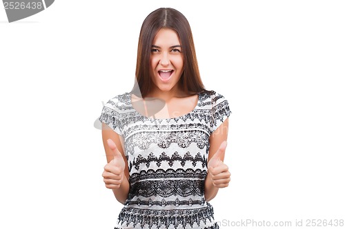 Image of Attractive young woman shows thumb up sign