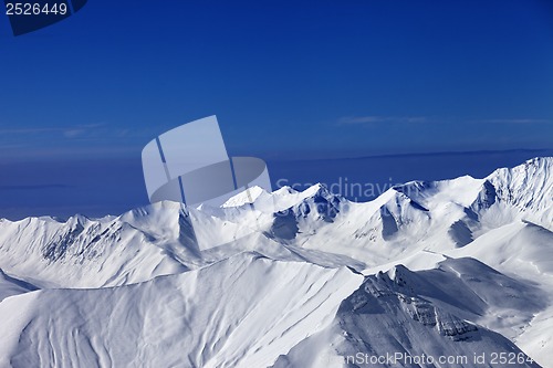 Image of View on off-piste slopes and blue sky at nice sunny day