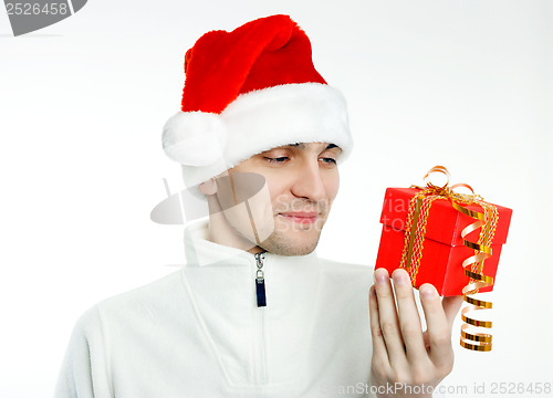 Image of man in a Santa hat with Christmas gift