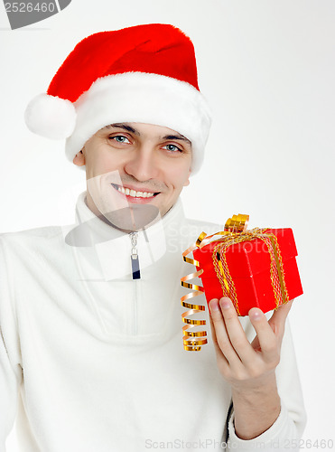 Image of man in a Santa hat with Christmas gift