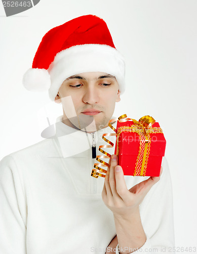 Image of man in a Santa hat with Christmas gift