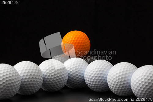 Image of Golf balls on the black background