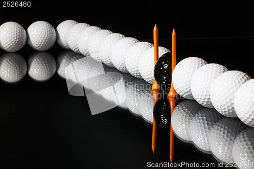 Image of Golf balls on the black background