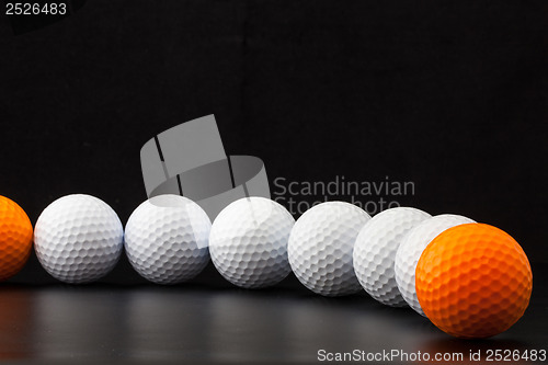 Image of Golf balls on the black background